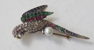 A brooch in the form of a parrot set emeralds, rubies, sapphires  and a pearl  ILLUSTRATED