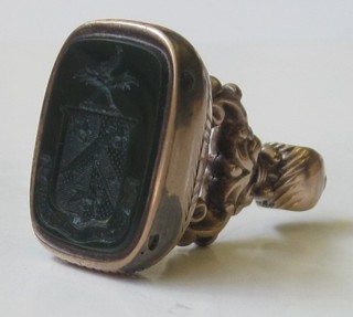 A 19th Century gilt metal seal with intaglio armorial decoration