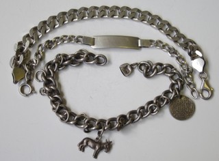 2 silver identity bracelets, a silver flat link bracelet and a silver  curb link bracelet hung charms