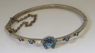 A silver bangle set turquoise