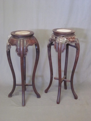 A pair of circular Oriental Padouk jardiniere stands with white  veined marble tops, raised on cabriole supports 11"