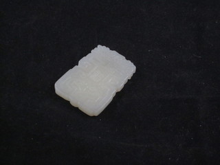 A rectangular carved section of jade 2"