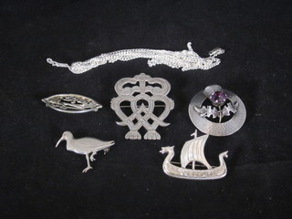 A Scots silver brooch in the form of a thistle, a brooch in the  form of a long ship, a pierced silver Art Nouveau style brooch, a  bird brooch, 1 other brooch and a silver chain