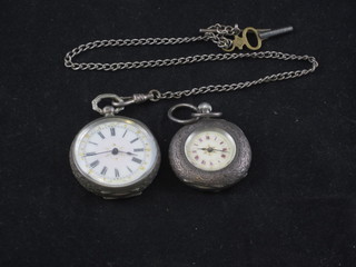 2 Continental open faced fob watches contained in silver cases, 1  hung on a silver chain