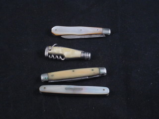 A silver bladed folding fruit knife with mother of pearl grip, a  fruit knife with m.o.p grip, a small jack knife and 1 other pocket  knife