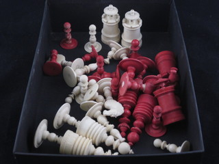 A red and white carved ivory chess set