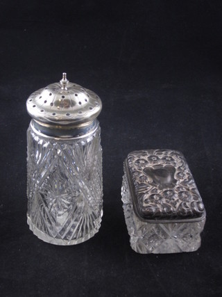 A Edwardian cut glass sugar sifter with silver top 4" and a rectangular dressing table jar with embossed metal lid