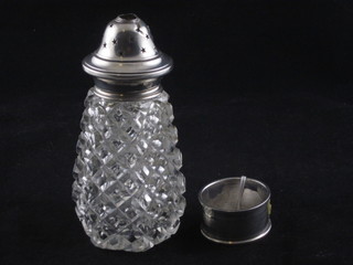 A silver napkin ring together with a cut glass sugar sifter with silver lid