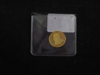 A 1979 Punjab mint 9ct gold Kruger commemorative coin