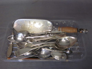 A silver plated crumb scoop and a collection of silver plated flatware