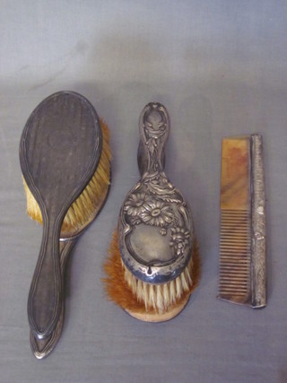 A pair of silver backed hairbrushes, 2 other silver backed hairbrushes and a comb