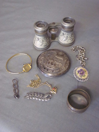 A Continental embossed white metal compact, a pair of opera  glasses, small collection of costume jewellery