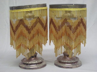A pair of silver plated candlesticks 11" hung beads