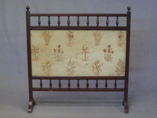 An Edwardian mahogany firescreen with tapestry panel and  bobbin turned decoration, 32"
