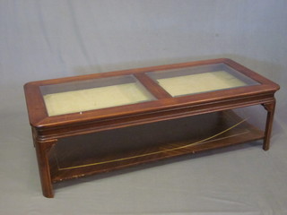 A rectangular mahogany bijouterie table with undertier, raised on shaped supports 54"