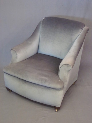 A Victorian armchair upholstered in blue material