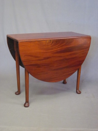 A Georgian mahogany oval drop flap tea table, raised on club  supports 76"