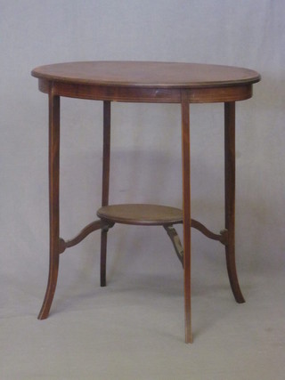 An Edwardian oval inlaid mahogany 2 tier occasional table with crossbanded top, raised on square tapering supports 27"