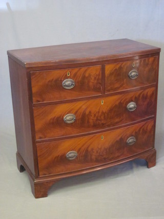 A Georgian mahogany bow front chest of 2 short and 2 long  drawers, raised on bracket feet 36"