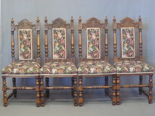 A set of Victorian 4 oak high back dining chairs with upholstered  seat and backs, raised on turned and block supports