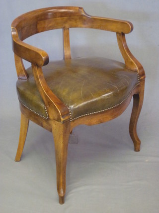A Victorian Continental mahogany tub back desk chair with  upholstered seat, raised on cabriole supports