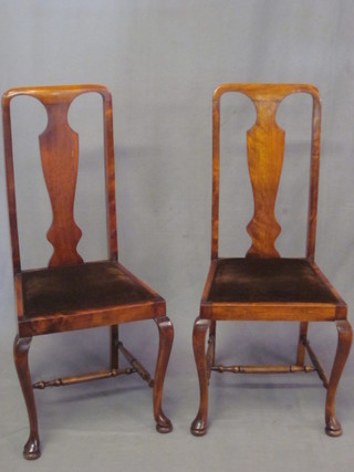 A set of 4 Queen Anne style mahogany slat back dining chairs  with upholstered drop in seats, raised on cabriole supports with H  framed stretchers