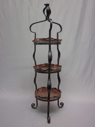 An Art Nouveau planished copper and wrought iron 3 tier cake  stand