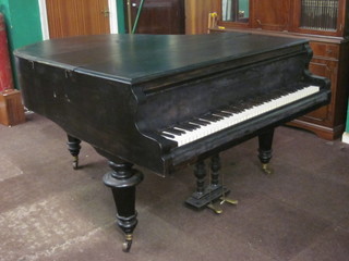 A Boudoir grand piano, contained in an ebonised case raised on  turned supports