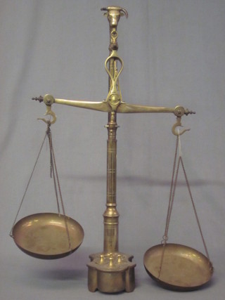 A pair of reproduction brass scales, missing 3 weights
