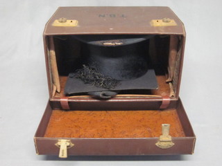 A gentleman's black silk top hat by Tress & Co, some wear to  brim, together with a mortar board, contained in a carrying case