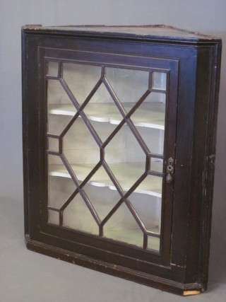 A 19th Century double corner cabinet, the upper section with moulded cornice, the shelved interior enclosed by an astragal  glazed panelled door, the base fitted a double cupboard, raised on  bracket feet 36"