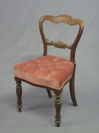 A Victorian bleached walnut spoon back chair with carved mid  rail, the seat of serpentine outline upholstered in pink buttoned  material, raised on turned supports