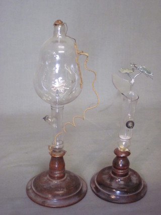A novelty blown glass discharge tube and 1 other - f,