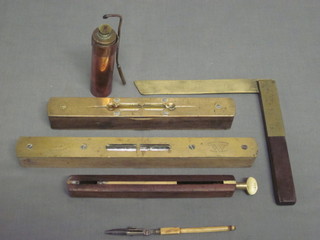 2 wooden and brass spirit levels, a wooden and brass square, a brass and hardwood gauge etc