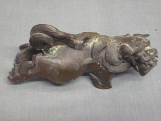 An Oriental bronze figure of a stylised lion 3 1/2"