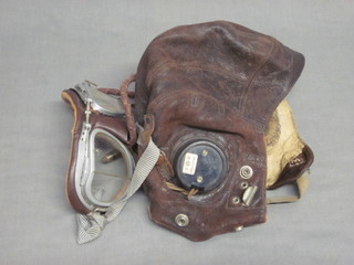 A leather flying helmet, the ear pieces marked AM 10A/13466,  marked inside 53 Squadron Flying Officer, complete with  goggles