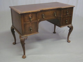A Queen Anne style oak writing table within inset tooled writing surface, fitted 1 long drawer flanked by 4 short drawers, raised  on cabriole supports 42"