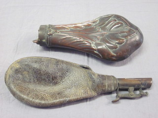 A 19th Century embossed copper powder flask and a leather and  brass shot flask, both f,