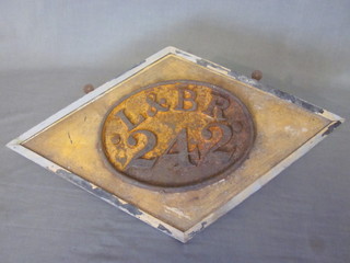 An oval iron plaque marked L & BR 242 9"   ILLUSTRATED