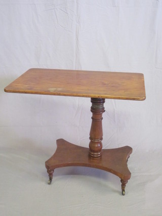 A 19th Century rectangular mahogany invalid table, raised on a  turned column with triform base 32"