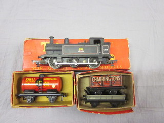 A Triang OO gauge model tank engine, a TTR Shell Oil tank  wagon no. 643 and 2 goods wagons, all boxed