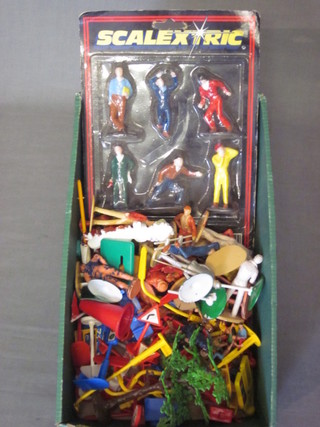 A box containing various Scalectrix figures