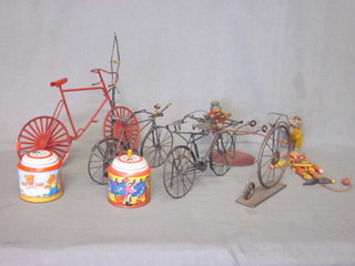 A collection of tin plate items, model bicycles etc
