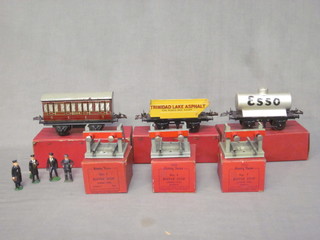 A Hornby O gauge R155 Voiture no.1, boxed, a no.1 R173  rotary tipping wagon boxed, a no.1 R171 Esso petrol tanker  wagon boxed, 3 no.1 buffer stoppers boxed, a no.501 tender  box and 4 figures