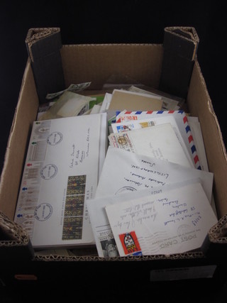 A box containing various first day covers
