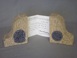A pair of stone and lead book ends, formed from parts of The  Houses of Parliament 6", together with a certificate