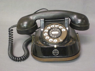 A Belgium dial telephone contained in a metal case