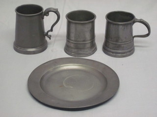 A circular pewter plate with London touch marks 9", a 1 pint  tankard, a beaker and a 1 pint tankard