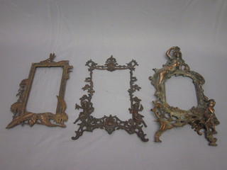 An Art Nouveau style gilt metal photograph frame decorated a  lady, 1 other decorated cherubs and 1 decorated leaves etc