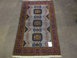 A brown Belouch rug with 3 stylised octagons to the centre 74" x  41"